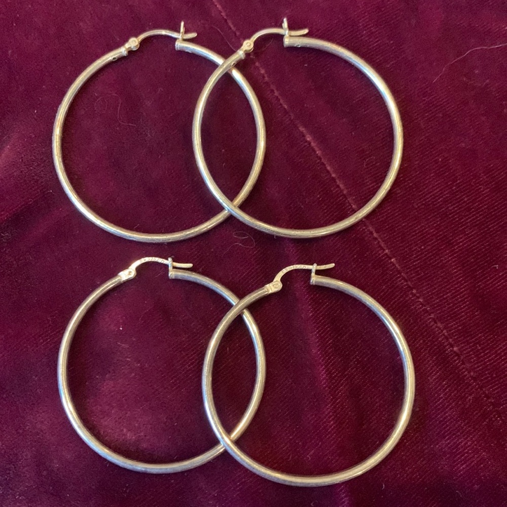 GIFTED: Two different sizes of solid, not plated hoops. Classic. Timeless.